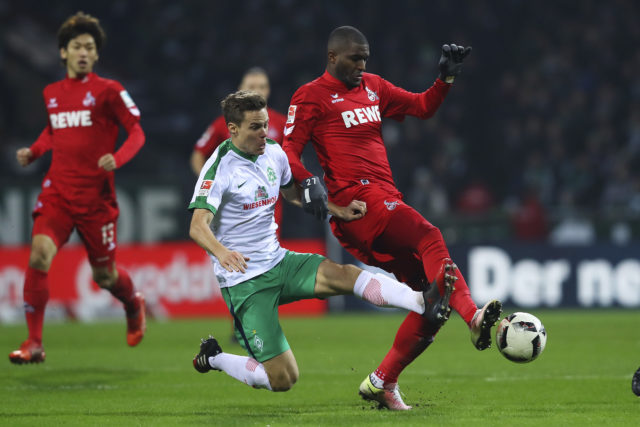 BREMEN, GERMANY - DECEMBER 17: Niklas Moisander (L) of Bremen and Anthony Modeste (R) Koeln compete for the ball during the Bundesliga match between Werder Bremen and 1. FC Koeln at Weserstadion on December 17, 2016 in Bremen, Germany. 