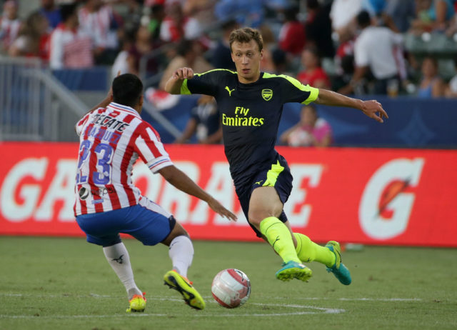 CARSON, CA - JULY 31: Krystian Bielik #37 of Arsenal is defended by Jose Vazquez #23 of Chivas de Guadalajara at StubHub Center on July 31, 2016 in Carson, California. (Photo by Jeff Gross/Getty Images)