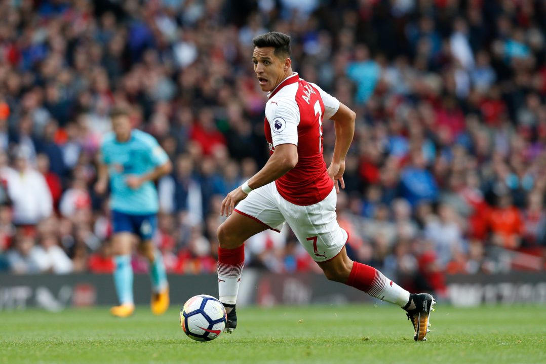 Arsenal's Chilean striker Alexis Sanchez runs with the ball during the English Premier League football match between Arsenal and Bournemouth at the Emirates Stadium in London on September 9, 2017. / AFP PHOTO / Ian KINGTON / RESTRICTED TO EDITORIAL USE. No use with unauthorized audio, video, data, fixture lists, club/league logos or 'live' services. Online in-match use limited to 75 images, no video emulation. No use in betting, games or single club/league/player publications. / (Photo credit should read IAN KINGTON/AFP/Getty Images)