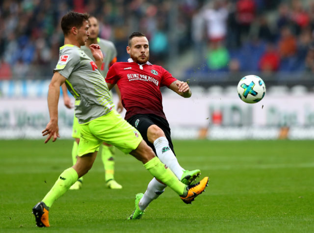 HANOVER, GERMANY - SEPTEMBER 24: Marvin Bakalorz (R) of Hannover and Salih Oezcan of Koeln battle for the ball during the Bundesliga match between Hannover 96 and 1. FC Koeln at HDI-Arena on September 24, 2017 in Hanover, Germany. (Photo by Martin Rose/Bongarts/Getty Images)