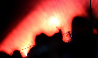 MOENCHENGLADBACH, GERMANY - FEBRUARY 14: Fans of Koeln are seen with flares during the Bundesliga match between Borussia Moenchengladbach and 1. FC Koeln at Borussia Park Stadium on February 14, 2015 in Moenchengladbach, Germany. (Photo by Lars Baron/Bongarts/Getty Images)