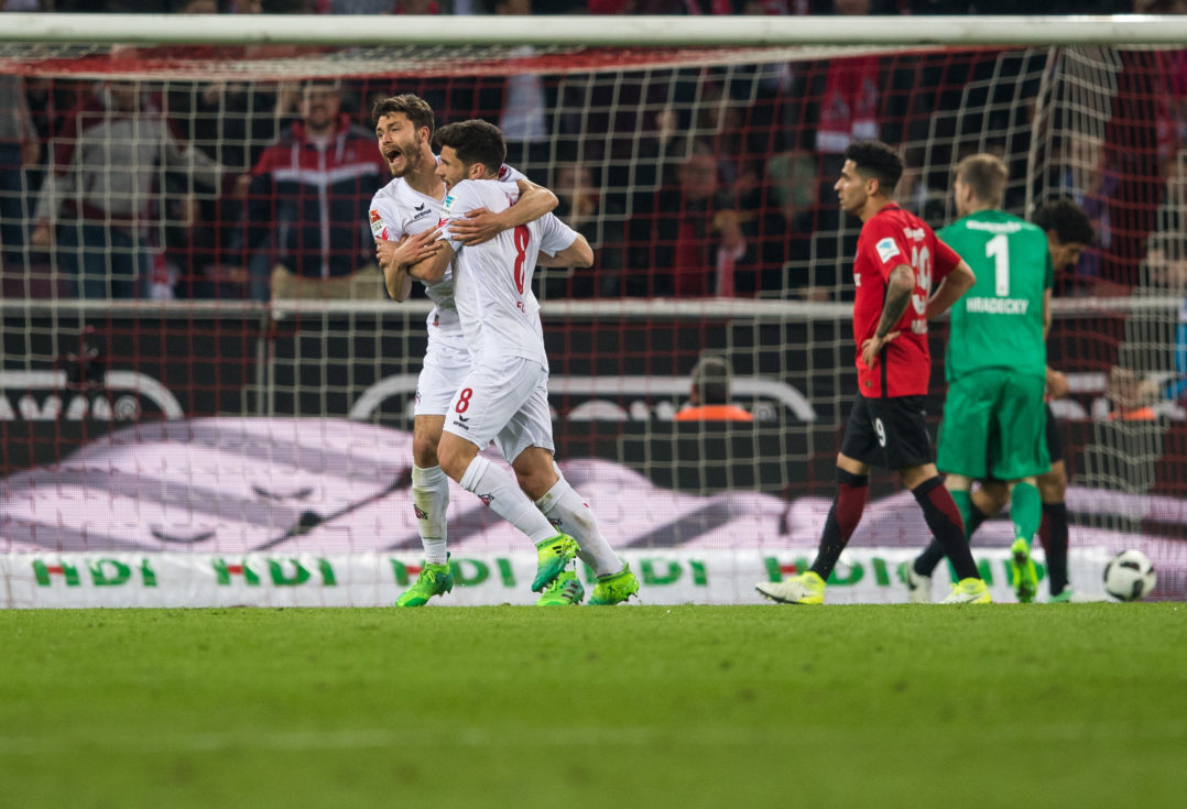 COLOGNE, GERMANY - APRIL 04: Milos Jojic (R) of Koeln celebrates his teams first goal with Jonas Hector (L) of Koeln during the Bundesliga match between 1. FC Koeln and Eintracht Frankfurt at RheinEnergieStadion on April 4, 2017 in Cologne, Germany.