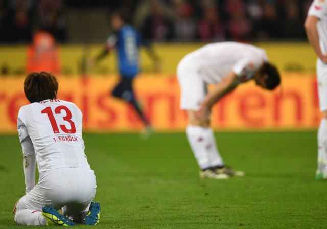 Cologne´s players react after the German first division Bundesliga football match of 1.FC Cologne vs TSG Hoffenheim in Cologne, western Germany, on April 21, 2017.
