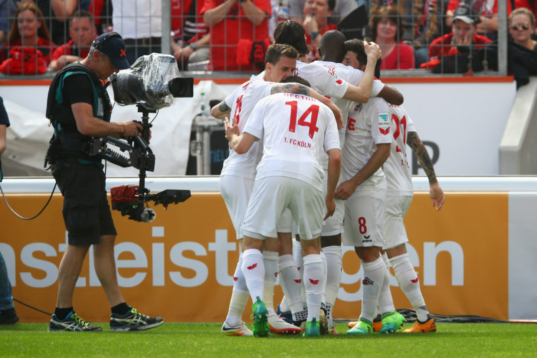 LEVERKUSEN, GERMANY - MAY 13: Milos Jojic of Koeln celebrates scoring his teams first goal of the game with team mates during the Bundesliga match between Bayer 04 Leverkusen and 1. FC Koeln at BayArena on May 13, 2017 in Leverkusen, Germany.