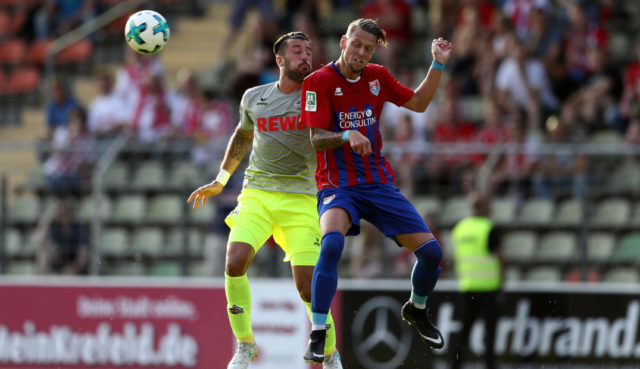 KREFELD, GERMANY - JULY 21: Dominic Maroh of Koeln challenges Connor Krempicki of Krefeld during the preseason friendly match between KFC Uerdingen and 1. FC Koeln at on July 21, 2017 in Krefeld, Germany. (Photo by Lars Baron/Bongarts/Getty Images)