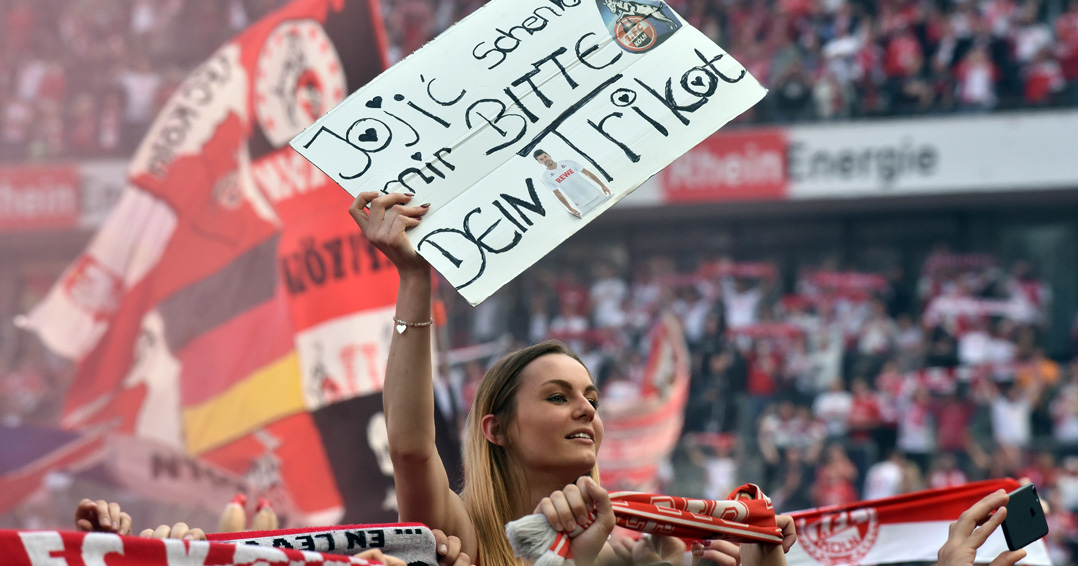 COLOGNE, GERMANY - MAY 20: A female supporter of Cologne lifts a sign to ask for the shirt of Milos Jojic after the Bundesliga match between 1. FC Koeln and 1. FSV Mainz 05 at RheinEnergieStadion on May 20, 2017 in Cologne, Germany. Cologne will play Europe League next season. (Photo by Juergen Schwarz/Bongarts/Getty Images)
