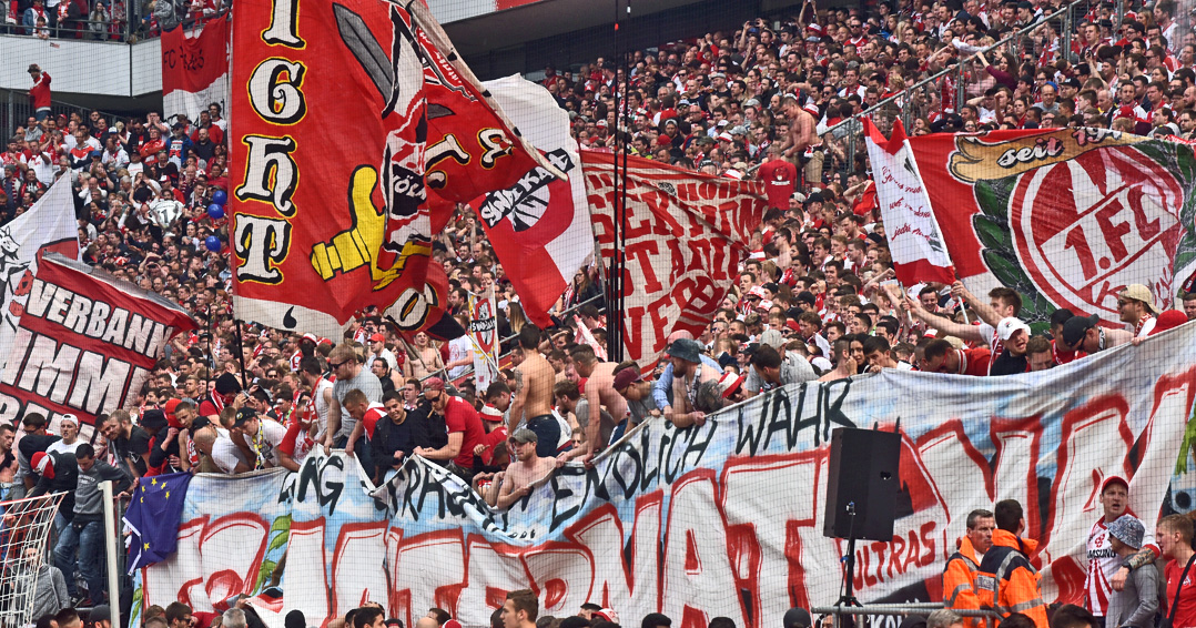 COLOGNE, GERMANY - MAY 20: Fans of Cologne support their team during the Bundesliga match between 1. FC Koeln and 1. FSV Mainz 05 at RheinEnergieStadion on May 20, 2017 in Cologne, Germany. Cologne will play Europe League next season. (Photo by Juergen Schwarz/Bongarts/Getty Images)