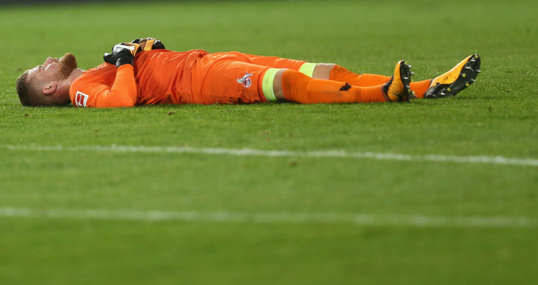 COLOGNE, GERMANY - SEPTEMBER 20: Timo Horn of Kln lies on the pitch after the Bundesliga match between 1. FC Koeln and Eintracht Frankfurt at RheinEnergieStadion on September 20, 2017 in Cologne, Germany. The match between Koeln and DFrankfurt ended 0-1. (Photo by Christof Koepsel/Bongarts/Getty Images)