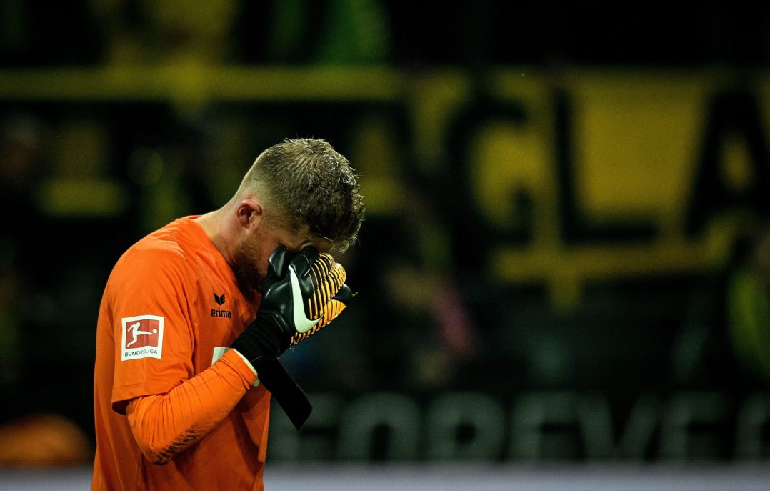 Cologne's German goalkeeper Timo Horn reacts after the German first division Bundesliga football match Borussia Dortmund v FC Cologne, in Dortmund, western Germany, on September 17, 2017. / AFP PHOTO / SASCHA SCHUERMANN / RESTRICTIONS: DURING MATCH TIME: DFL RULES TO LIMIT THE ONLINE USAGE TO 15 PICTURES PER MATCH AND FORBID IMAGE SEQUENCES TO SIMULATE VIDEO. == RESTRICTED TO EDITORIAL USE == FOR FURTHER QUERIES PLEASE CONTACT DFL DIRECTLY AT + 49 69 650050 (Photo credit should read SASCHA SCHUERMANN/AFP/Getty Images)
