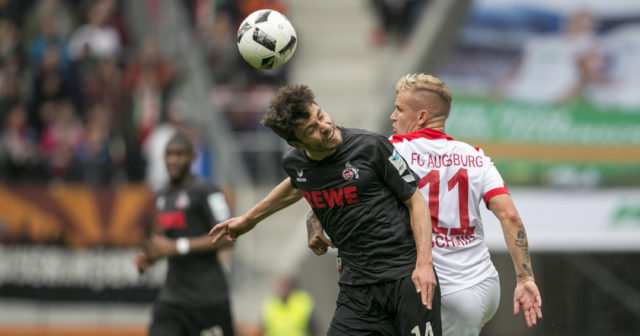AUGSBURG, GERMANY - APRIL 15: Jonas Hector of Cologne and Jonathan Schmid of FC Augsburg battle for the ball during the Bundesliga match between FC Augsburg and 1. FC Koeln at WWK Arena on April 15, 2017 in Augsburg, Germany. (Photo by Jan Hetfleisch/Bongarts/Getty Images)