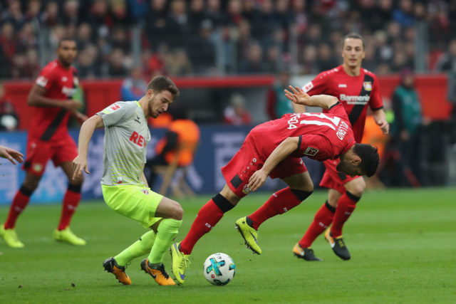 LEVERKUSEN, GERMANY - OCTOBER 28: (L-R) Sahil zcan of Kln challenges Kevin Volland of Leverkusen during the Bundesliga match between Bayer 04 Leverkusen and 1. FC Koeln at BayArena on October 28, 2017 in Leverkusen, Germany. (Photo by Christof Koepsel/Bongarts/Getty Images)
