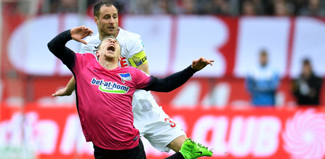 Cologne's midfielder Matthias Lehmann and Hertha's midfielder Mitchell Weiser vie for the ball during the German first division Bundesliga football match of 1.FC Cologne vs Hertha BSC Berlin in Cologne, western Germany, on March 18, 2017. / AFP PHOTO / PATRIK STOLLARZ / RESTRICTIONS: DURING MATCH TIME: DFL RULES TO LIMIT THE ONLINE USAGE TO 15 PICTURES PER MATCH AND FORBID IMAGE SEQUENCES TO SIMULATE VIDEO. == RESTRICTED TO EDITORIAL USE == FOR FURTHER QUERIES PLEASE CONTACT DFL DIRECTLY AT + 49 69 650050 (Photo credit should read PATRIK STOLLARZ/AFP/Getty Images)