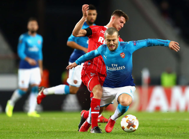 COLOGNE, GERMANY - NOVEMBER 23: Salih Özcan of FC Koeln tackles Jack Wilshere of Arsenal during the UEFA Europa League group H match between 1. FC Koeln and Arsenal FC at RheinEnergieStadion on November 23, 2017 in Cologne, Germany. (Photo by Dean Mouhtaropoulos/Getty Images)