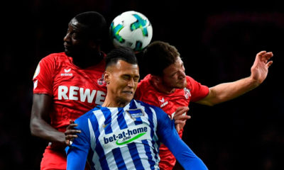 Berlin's German forward Davie Selke (C) Cologne's German midfielder Salih Ozcan (R) and Cologne's French forward Sehrou Guirassy vie for the ball during the German Cup (DFB Pokal) football match Hertha Berlin v 1 FC Cologne at the Olympic stadium in Berlin on October 25, 2017. / AFP PHOTO / John MACDOUGALL / RESTRICTIONS: ACCORDING TO DFB RULES IMAGE SEQUENCES TO SIMULATE VIDEO IS NOT ALLOWED DURING MATCH TIME. MOBILE (MMS) USE IS NOT ALLOWED DURING AND FOR FURTHER TWO HOURS AFTER THE MATCH. == RESTRICTED TO EDITORIAL USE == FOR MORE INFORMATION CONTACT DFB DIRECTLY AT +49 69 67880 / (Photo credit should read JOHN MACDOUGALL/AFP/Getty Images)