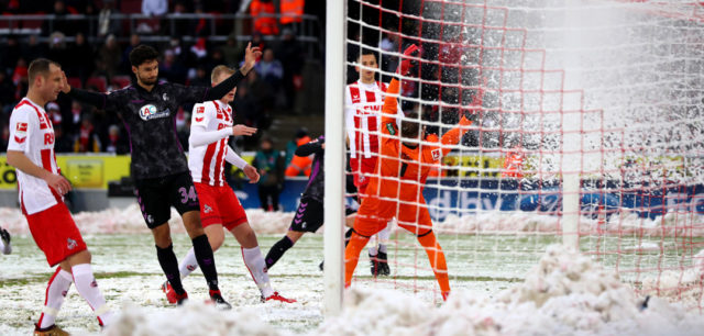 COLOGNE, GERMANY - DECEMBER 10: Nils Petersen of SC Freiburg shoots and scores his side's first goal during the Bundesliga match between 1. FC Koeln and Sport-Club Freiburg at RheinEnergieStadion on December 10, 2017 in Cologne, Germany. (Photo by Dean Mouhtaropoulos/Bongarts/Getty Images)