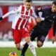 COLOGNE, GERMANY - DECEMBER 10: Pawel Olkowski of FC Koeln and Janik Haberer of SC Freiburg battle for the ball during the Bundesliga match between 1. FC Koeln and Sport-Club Freiburg at RheinEnergieStadion on December 10, 2017 in Cologne, Germany. (Photo by Dean Mouhtaropoulos/Bongarts/Getty Images)