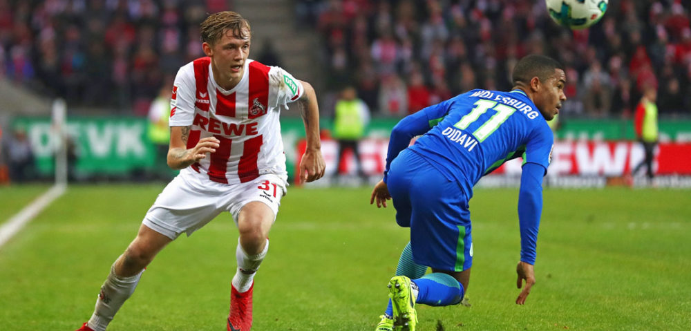 COLOGNE, GERMANY - DECEMBER 16: Birk Risa of FC Koeln battles for the ball with Daniel Didavi of Wolfsburg during the Bundesliga match between 1. FC Koeln and VfL Wolfsburg at RheinEnergieStadion on December 16, 2017 in Cologne, Germany. (Photo by Dean Mouhtaropoulos/Bongarts/Getty Images)