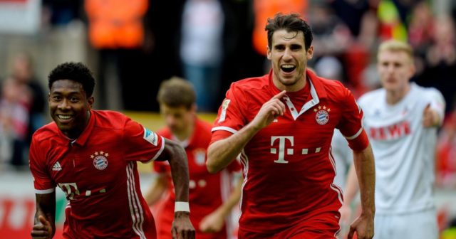 Bayern Munich's Spanish midfielder Javier Martinez (R) celebrates scoring the opening goal during the German First division Bundesliga football match between 1 FC Cologne and FC Bayern Munich in Cologne, western Germany, on March 4, 2017.