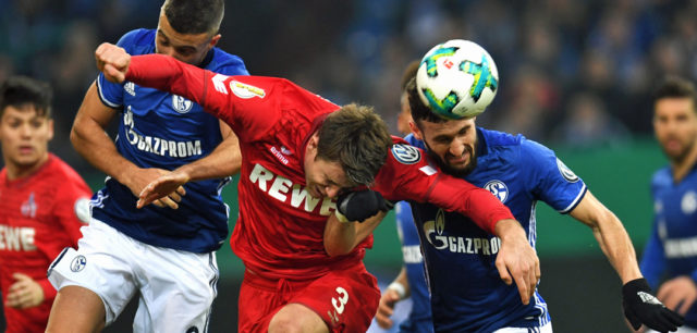 Schalke's Argentinian forward Franco di Santo, Schalke's German midfielder Daniel Caligiuri and Cologne's German defender Dominique Heintz vie for the ball during the German football Cup DFB Pokal round of sixteen match FC Schalke 04 vs FC Cologne in Gelsenkirchen, western Germany, on December 19, 2017. / AFP PHOTO / Patrik STOLLARZ / RESTRICTIONS: ACCORDING TO DFB RULES IMAGE SEQUENCES TO SIMULATE VIDEO IS NOT ALLOWED DURING MATCH TIME. MOBILE (MMS) USE IS NOT ALLOWED DURING AND FOR FURTHER TWO HOURS AFTER THE MATCH. == RESTRICTED TO EDITORIAL USE == FOR MORE INFORMATION CONTACT DFB DIRECTLY AT +49 69 67880 / (Photo credit should read PATRIK STOLLARZ/AFP/Getty Images)