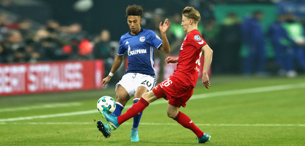 DECEMBER 19: Thilo Kehrer (L) of Schalke battles for the ball with Chris Fuehrich of Koeln during the DFB Cup match between FC Schalke 04 and 1.FC Koeln at Veltins-Arena on December 19, 2017 in Gelsenkirchen, Germany. (Photo by Lars Baron/Bongarts/Getty Images)