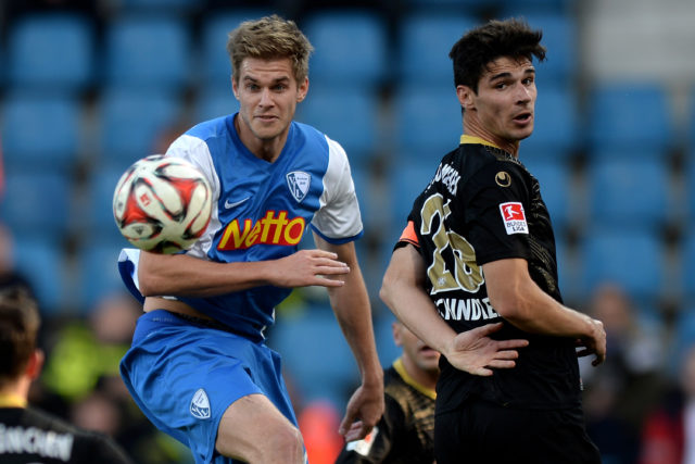 BOCHUM, GERMANY - NOVEMBER 02: (L-R) Simon Terodde of Bochum vies with Christopher Schindler of Muenchen during the 2. Bundesliga match between VfL Bochum and 1860 Muenchen at Rewirpower Stadium on November 2, 2014 in Bochum, Germany. (Photo by Sascha Steinbach/Bongarts/Getty Images)