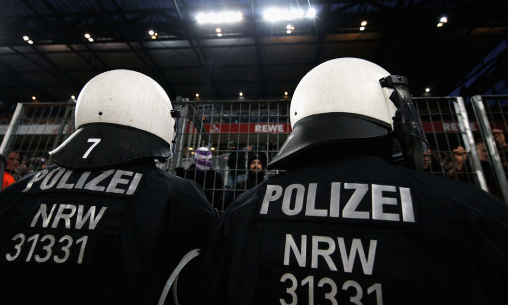 COLOGNE, GERMANY - JANUARY 14: Police or Polizei watch the fans of Borussia Monchengladbach during the Bundesliga match between 1. FC Koeln and Borussia Moenchengladbach at RheinEnergieStadion on January 14, 2018 in Cologne, Germany. (Photo by Dean Mouhtaropoulos/Bongarts/Getty Images)
