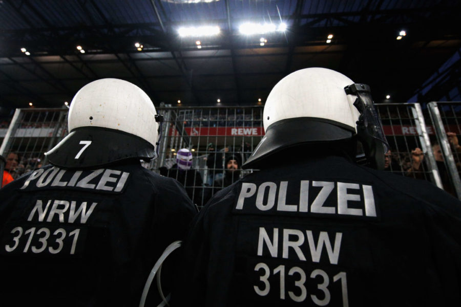 COLOGNE, GERMANY - JANUARY 14: Police or Polizei watch the fans of Borussia Monchengladbach during the Bundesliga match between 1. FC Koeln and Borussia Moenchengladbach at RheinEnergieStadion on January 14, 2018 in Cologne, Germany. (Photo by Dean Mouhtaropoulos/Bongarts/Getty Images)