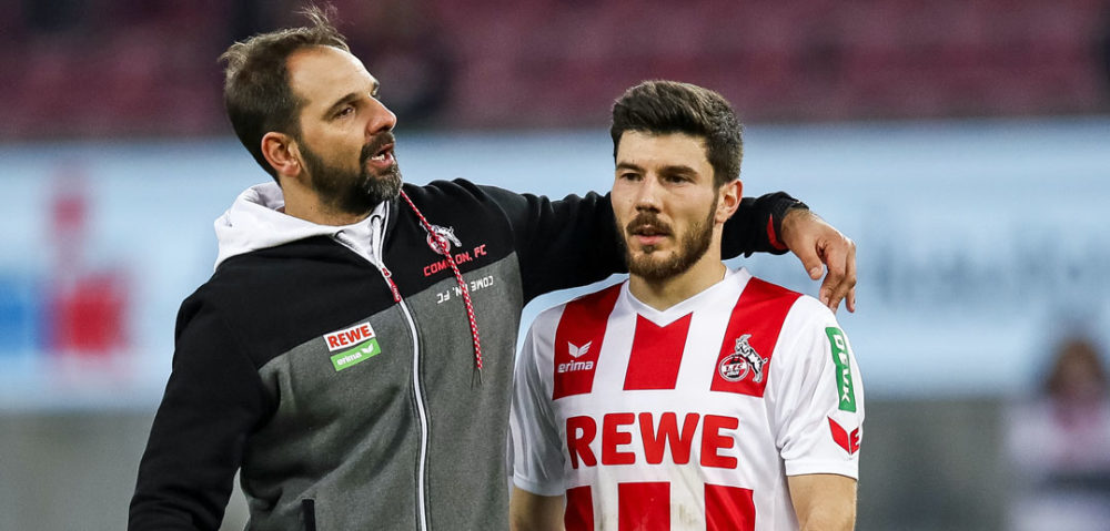 COLOGNE, GERMANY - JANUARY 27: Stefan Ruthenbeck Head Coach of 1. FC Koeln and Milos Jojic #8 of 1.FC Koeln react after the Bundesliga match between 1. FC Koeln and FC Augsburg at RheinEnergieStadion on January 27, 2018 in Cologne, Germany. (Photo by Maja Hitij/Bongarts/Getty Images)