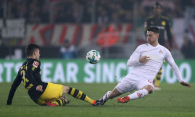 COLOGNE, GERMANY - FEBRUARY 02: Julian Weigl of Dortmund is challenged by Salih Ozcan of Cologne during the Bundesliga match between 1. FC Koeln and Borussia Dortmund at RheinEnergieStadion on February 2, 2018 in Cologne, Germany. (Photo by Alex Grimm/Bongarts/Getty Images)