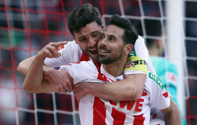 COLOGNE, GERMANY - FEBRUARY 17: Claudio Pizarro of Koeln celebrates his goal with team mate Jonas Hector before referee Markus Schmidt takes it back because of offside during the Bundesliga match between 1. FC Koeln and Hannover 96 at RheinEnergieStadion on February 17, 2018 in Cologne, Germany. (Photo by Alex Grimm/Bongarts/Getty Images)