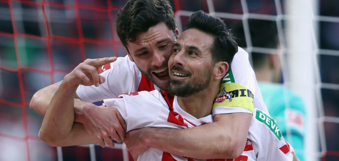 COLOGNE, GERMANY - FEBRUARY 17: Claudio Pizarro of Koeln celebrates his goal with team mate Jonas Hector before referee Markus Schmidt takes it back because of offside during the Bundesliga match between 1. FC Koeln and Hannover 96 at RheinEnergieStadion on February 17, 2018 in Cologne, Germany. (Photo by Alex Grimm/Bongarts/Getty Images)