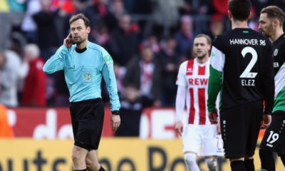 COLOGNE, GERMANY - FEBRUARY 17: Referee Markus Schmidt listens to the video assistant referee VAR on his headphone during the Bundesliga match between 1. FC Koeln and Hannover 96 at RheinEnergieStadion on February 17, 2018 in Cologne, Germany. (Photo by Alex Grimm/Bongarts/Getty Images)