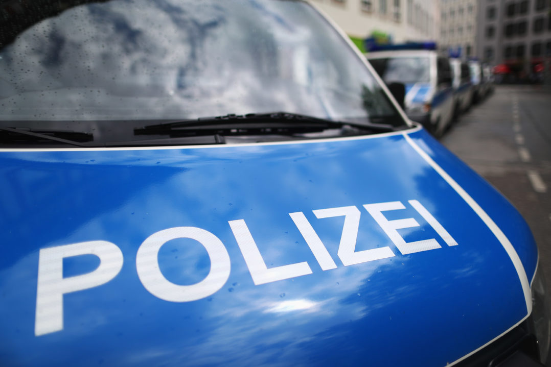 MUNICH, GERMANY - MAY 15: A fleet of police or Polizei vans are pictured parked near the fans of Bayern Muenchen as they celebrate winning the German Championship title on the town hall square at Marienplatz on May 15, 2016 in Munich, Germany. (Photo by Dean Mouhtaropoulos/Bongarts/Getty Images)