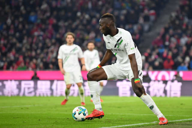 MUNICH, GERMANY - DECEMBER 02: Salif Sane of Hannover plays the ball during the Bundesliga match between FC Bayern Muenchen and Hannover 96 at Allianz Arena on December 2, 2017 in Munich, Germany. 