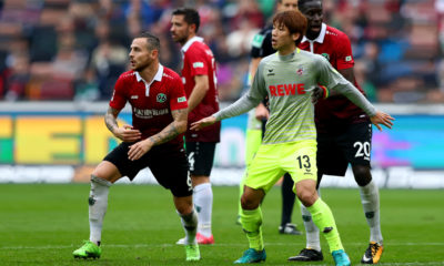 HANOVER, GERMANY - SEPTEMBER 24: Yuya Osako #13 of Koeln battle in action during the Bundesliga match between Hannover 96 and 1. FC Koeln at HDI-Arena on September 24, 2017 in Hanover, Germany. (Photo by Martin Rose/Bongarts/Getty Images)