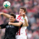 COLOGNE, GERMANY - MARCH 04: (L-R) Mario Gomez of Stuttgart and Frederik Soerensen of Koeln go up for a header during the Bundesliga match between 1. FC Koeln and VfB Stuttgart at RheinEnergieStadion on March 4, 2018 in Cologne, Germany. (Photo by Christof Koepsel/Bongarts/Getty Images)