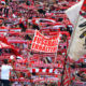 Cologne´s supporters celebrate during the German first division Bundesliga football match between FC Cologne and FC Ingolstadt 04, in Cologne, western Germany, on October 15, 2016. / AFP / PATRIK STOLLARZ / RESTRICTIONS: DURING MATCH TIME: DFL RULES TO LIMIT THE ONLINE USAGE TO 15 PICTURES PER MATCH AND FORBID IMAGE SEQUENCES TO SIMULATE VIDEO. == RESTRICTED TO EDITORIAL USE == FOR FURTHER QUERIES PLEASE CONTACT DFL DIRECTLY AT + 49 69 650050 (Photo credit should read PATRIK STOLLARZ/AFP/Getty Images)
