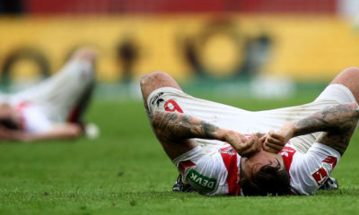 COLOGNE, GERMANY - APRIL 22: Marco Hoeger of Koeln lies dejected on the pitch after the Bundesliga match between 1. FC Koeln and FC Schalke 04 at RheinEnergieStadion on April 22, 2018 in Cologne, Germany. (Photo by Maja Hitij/Bongarts/Getty Images)