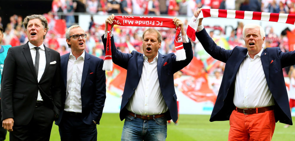 COLOGNE, GERMANY - MAY 23: (L-R) Toni Shcumacher, vice-president, chairman Alexander Wehrle, Markus Ritterbach, vice-president of Koeln and president Werner Spinner of Kolen sing the anthem prior to the Bundesliga match between 1. FC Koelan and VfL Wolfsburg at RheinEnergieStadion on May 23, 2015 in Cologne, Germany. (Photo by Christof Koepsel/Bongarts/Getty Images)