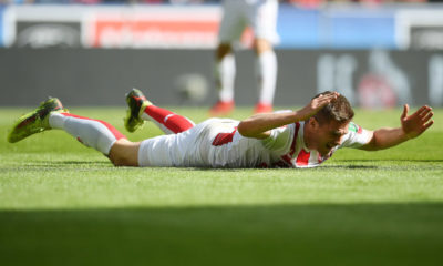 COLOGNE, GERMANY - APRIL 07: Simon Terodde of Koeln lies on the pitch and looks dejected during the Bundesliga match between 1. FC Koeln and 1. FSV Mainz 05 at RheinEnergieStadion on April 7, 2018 in Cologne, Germany. (Photo by Matthias Hangst/Bongarts/Getty Images)
