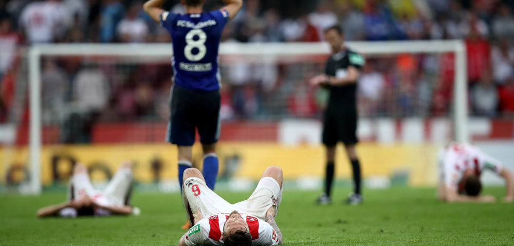 COLOGNE, GERMANY - APRIL 22: Marco Hoeger of Koeln lies dejected on the pitch after the Bundesliga match between 1. FC Koeln and FC Schalke 04 at RheinEnergieStadion on April 22, 2018 in Cologne, Germany. (Photo by Maja Hitij/Bongarts/Getty Images)