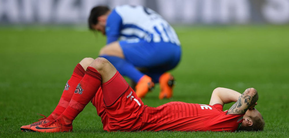 BERLIN, GERMANY - APRIL 14: Marcel Risse of Koeln lies on the pitch dejected after the Bundesliga match between Hertha BSC and 1. FC Koeln at Olympiastadion on April 14, 2018 in Berlin, Germany. (Photo by Stuart Franklin/Bongarts/Getty Images)