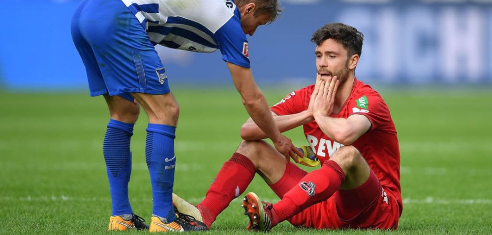 BERLIN, GERMANY - APRIL 14: Per Ciljan Skjelbred of Berlin (l) consoles Jonas Hector of Koeln after the Bundesliga match between Hertha BSC and 1. FC Koeln at Olympiastadion on April 14, 2018 in Berlin, Germany. (Photo by Stuart Franklin/Bongarts/Getty Images)