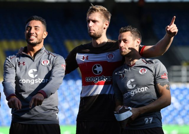 BRAUNSCHWEIG, GERMANY - OCTOBER 01: Aziz Bouhaddouz, Lasse Sobiech and Jan-Philipp Kalla of St. Pauli celebrate after the Second Bundesliga match between Eintracht Braunschweig and FC St. Pauli at Eintracht Stadion on October 1, 2017 in Braunschweig, Germany. (Photo by Stuart Franklin/Bongarts/Getty Images)