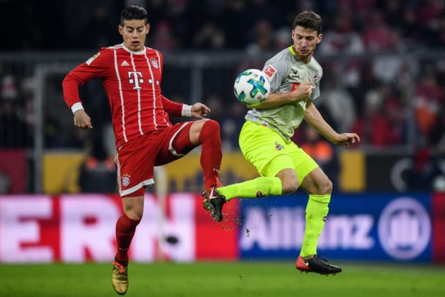MUNICH, GERMANY - DECEMBER 13: James Rodriguez #11 of Bayern Munich (L) and Salih Oezcan #20 of 1.FC Koeln battle for the ball during the Bundesliga match between FC Bayern Muenchen and 1. FC Koeln at Allianz Arena on December 13, 2017 in Munich, Germany. (Photo by Matthias Hangst/Bongarts/Getty Images)