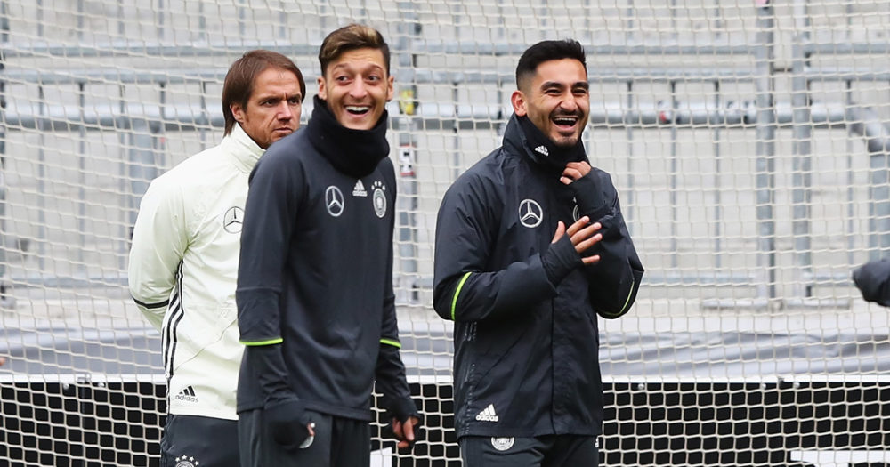 HAMBURG, GERMANY - OCTOBER 06: Ilkay Guendogan (2ndR) of Germany laughs with Mesut Oezil during a training session at Millerntor Stadion on October 6, 2016 in Hamburg, Germany. (Photo by Martin Rose/Bongarts/Getty Images)