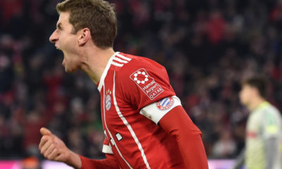 Bayern Munich's striker Thomas Mueller celebrates after the first goal during the German first division Bundesliga football match between FC Bayern Munich and FC Cologne on December 13, 2017 in Munich. / AFP PHOTO / Christof STACHE / RESTRICTIONS: DURING MATCH TIME: DFL RULES TO LIMIT THE ONLINE USAGE TO 15 PICTURES PER MATCH AND FORBID IMAGE SEQUENCES TO SIMULATE VIDEO. == RESTRICTED TO EDITORIAL USE == FOR FURTHER QUERIES PLEASE CONTACT DFL DIRECTLY AT + 49 69 650050 (Photo credit should read CHRISTOF STACHE/AFP/Getty Images)