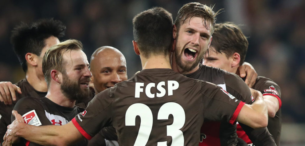 HAMBURG, GERMANY - DECEMBER 18: Lasse Sobiech (R) of Pauli celebrate after his first goal during the Second Bundesliga match between FC St. Pauli and VfL Bochum 1848 at Millerntor Stadium on December 18, 2017 in Hamburg, Germany. (Photo by Oliver Hardt/Bongarts/Getty Images)