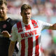 COLOGNE, GERMANY - APRIL 07: Simon Terodde of Stuttgart (r) runs for the ball with Alexander Hack of Mainz during the Bundesliga match between 1. FC Koeln and 1. FSV Mainz 05 at RheinEnergieStadion on April 7, 2018 in Cologne, Germany. (Photo by Matthias Hangst/Bongarts/Getty Images)