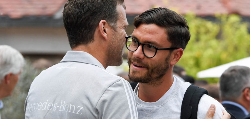 EPPAN, ITALY - MAY 23: (L-R) Team manager Oliver Bierhoff greets Jonas Hector as he arrives on day one of the Germany National Football team's training camp at Hotel Weinegg on May 23, 2018 in Eppan, Italy. (Photo by Markus Gilliar/DFB - Pool/Getty Images)